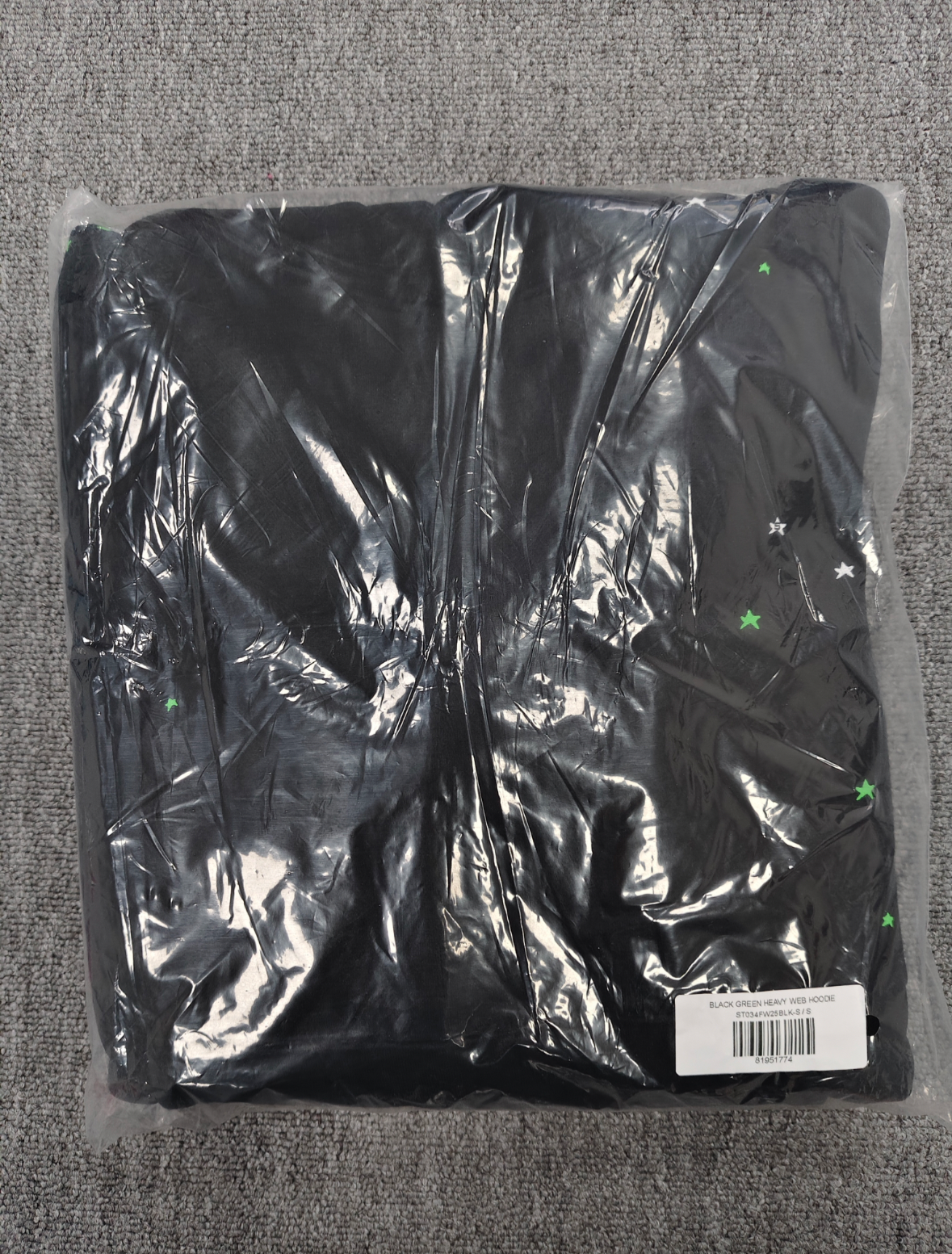 Sp5der Heavy Web Hoodie in black features a striking green and white star graphic print
