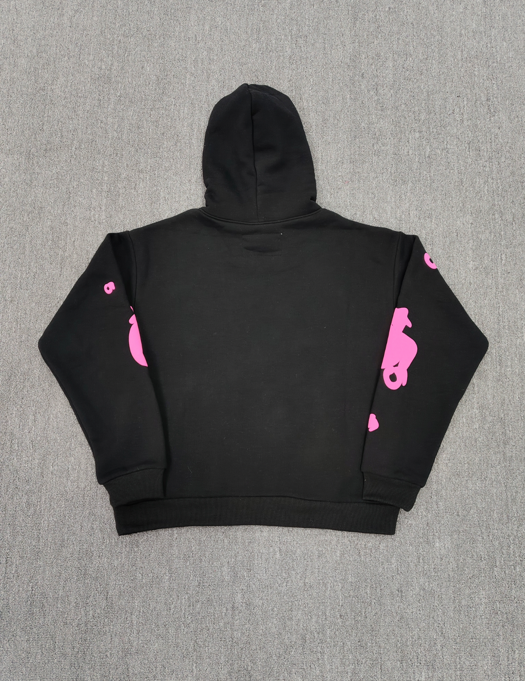 Sp5der Beluga Angel Number Hoodie in black featuring a prominent pink puff-print graphic on the chest