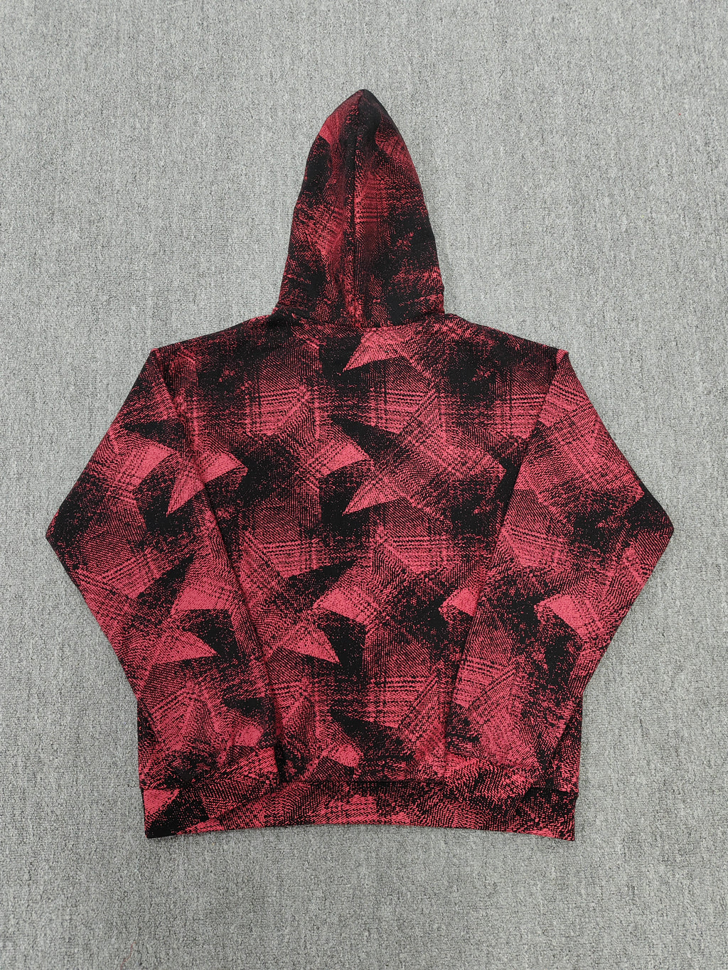 a Sp5der Plaid Splatt Hoodie in red, featuring a prominent white star graphic