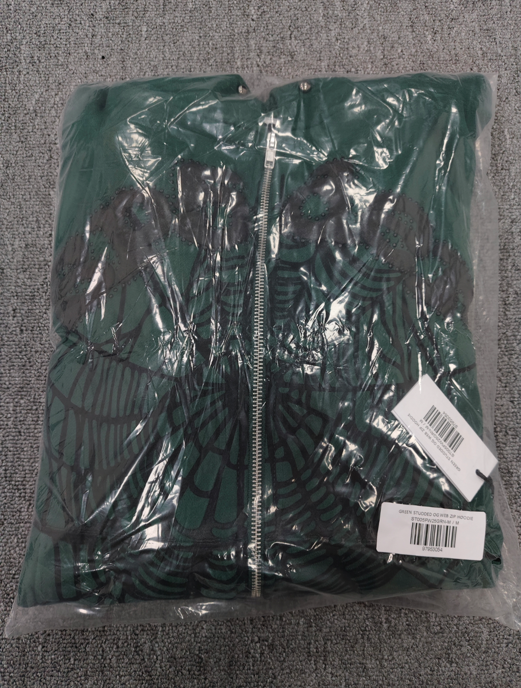 Sp5der OG Web Studded Zip Hoodie in green featuring black graphic detailing