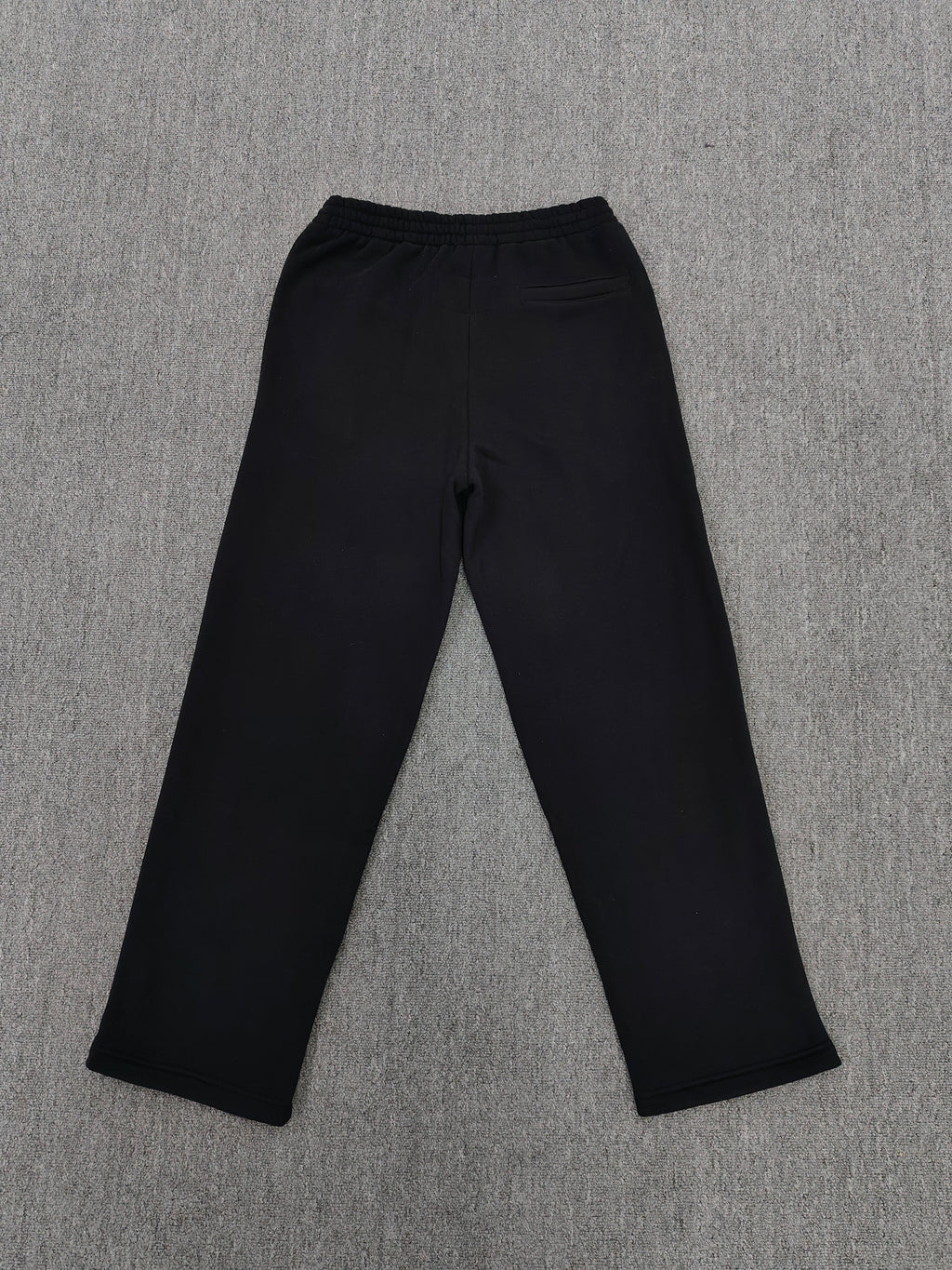 black SP5DER Rhinestone Punk V2 track pants feature rhinestone star embellishments and a rhinestone-encrusted logo