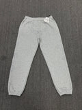light grey sp5der joggers feature a unique rhinestone across the front hip area