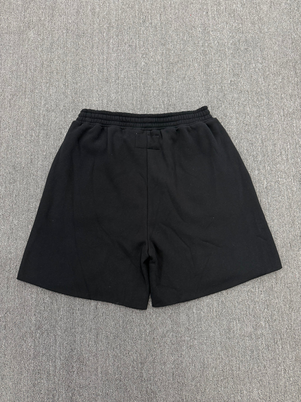 Sp5der Black Rhinestone Letter Print Jogger Shorts featuring a distinctive rhinestone star graphic.