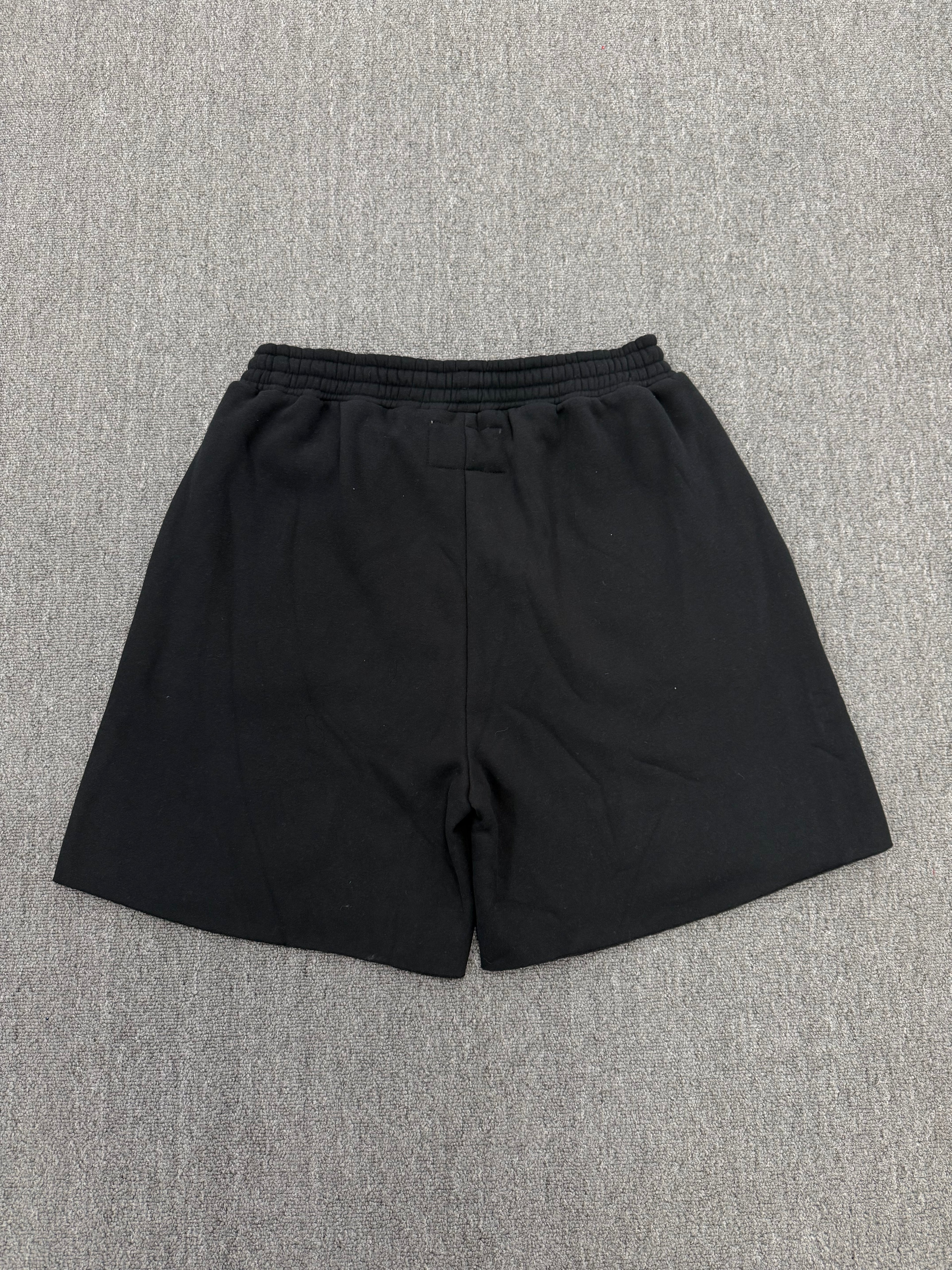 Sp5der Black Rhinestone Letter Print Jogger Shorts featuring a distinctive rhinestone star graphic.