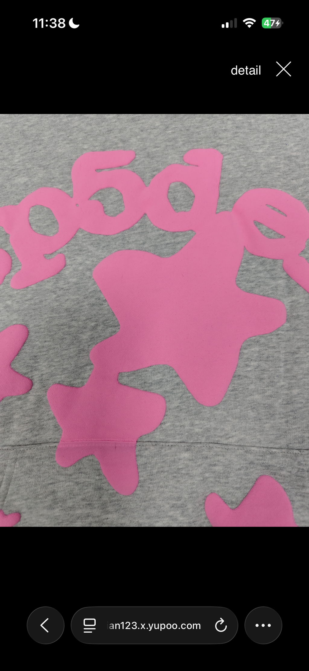 a grey Sp5der "Beluga" hoodie featuring pink star graphics and brand lettering