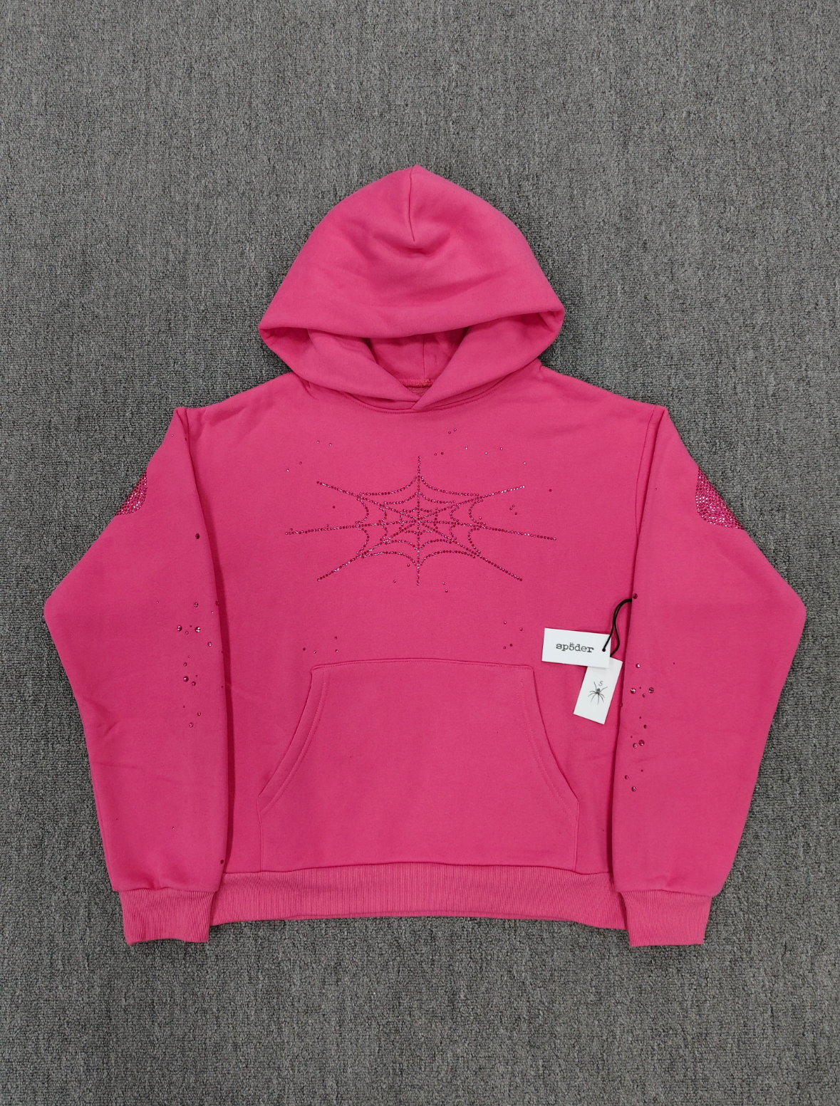 Sp5der Rhinestone Silk Hoodie in pink featuring a prominent rhinestone spiderweb graphic