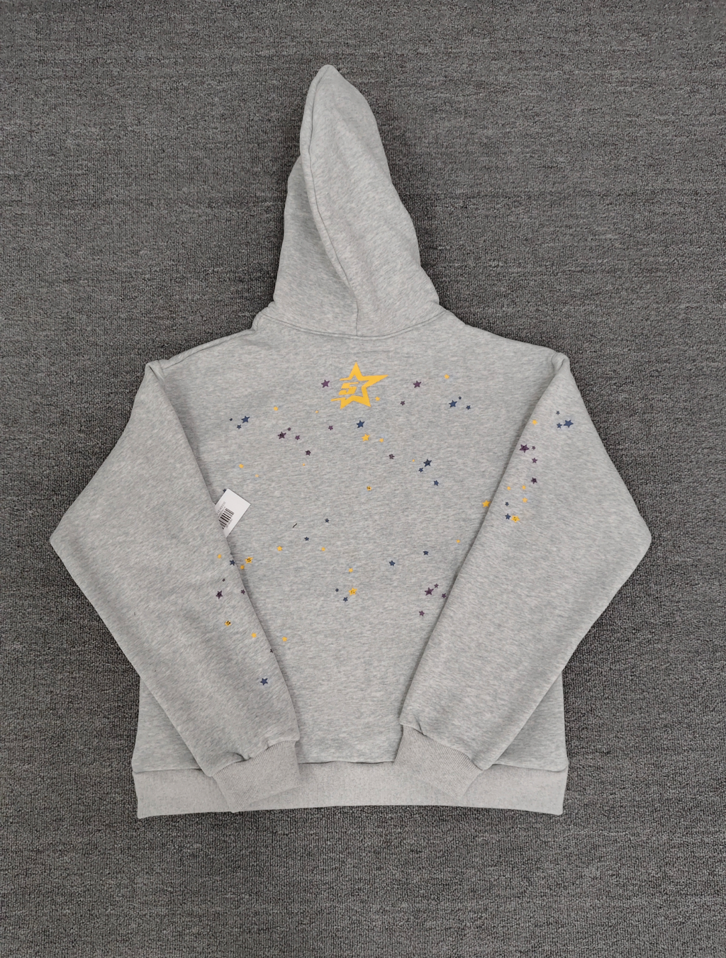 grey Sp5der hoodie features a prominent pink rhinestone graphic and a blue spiderweb design