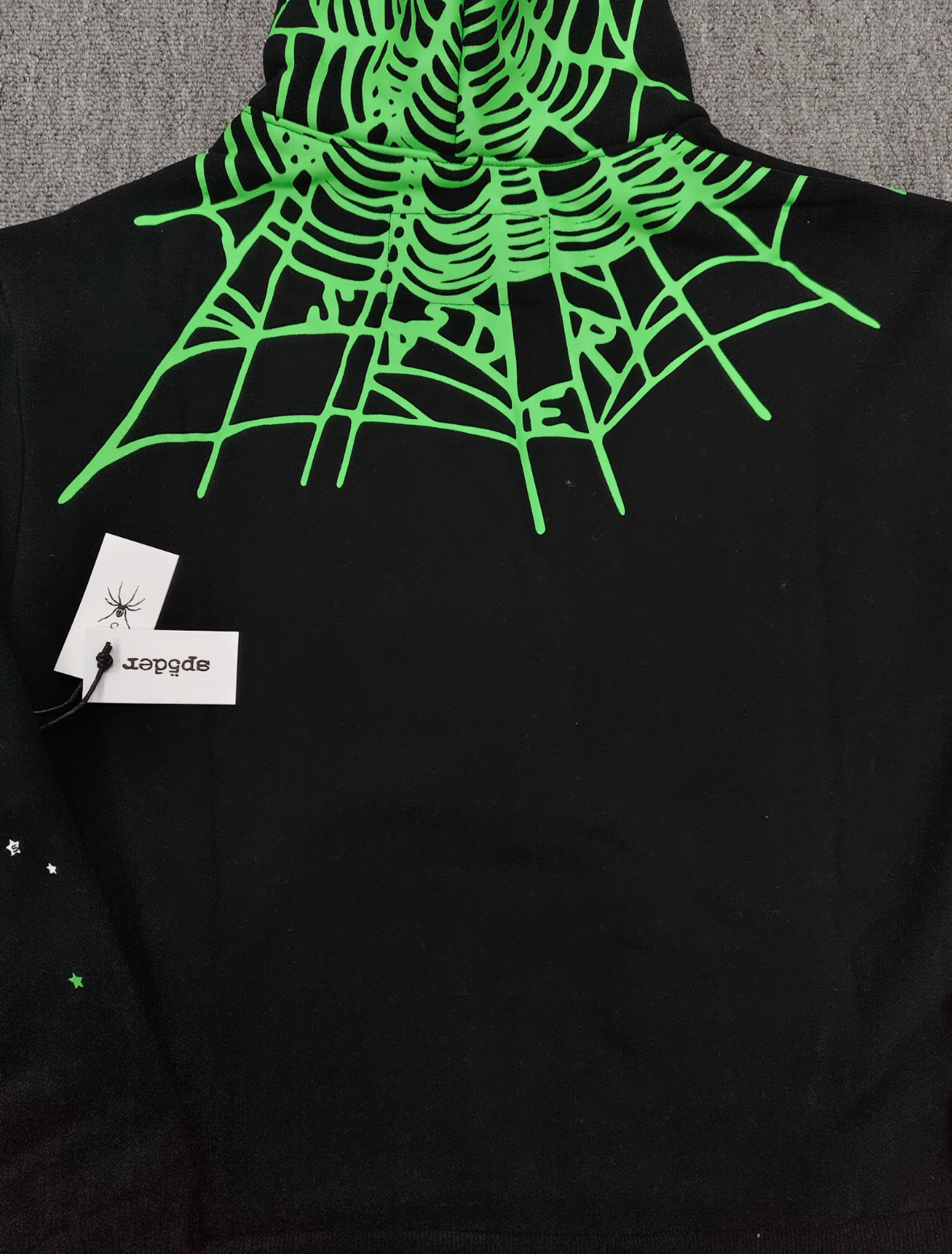 Sp5der Heavy Web Hoodie in black features a striking green and white star graphic print