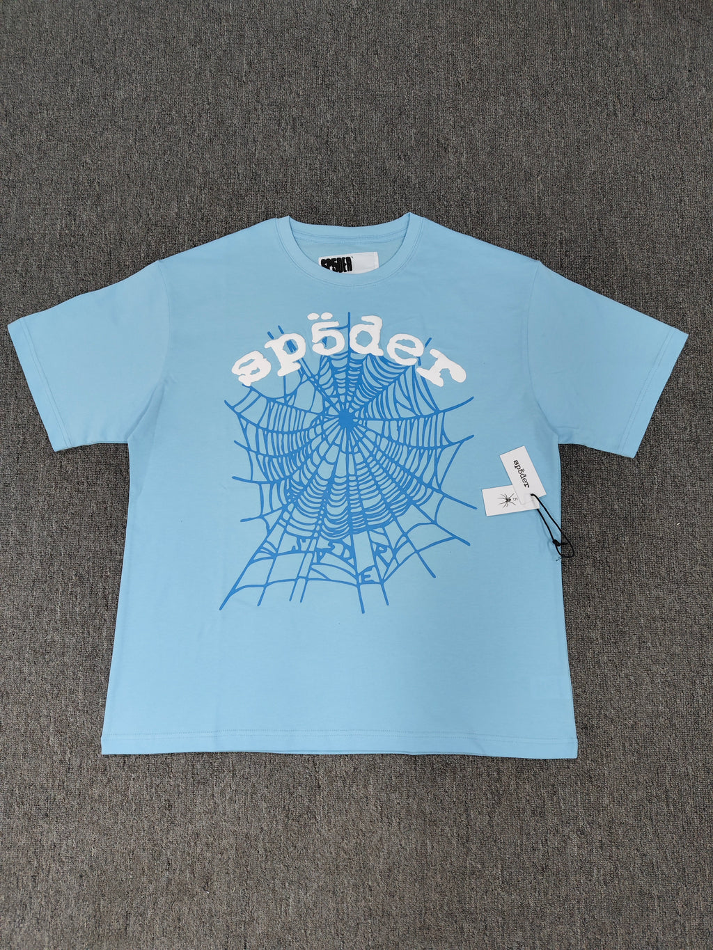 Sp5der shirts are featured in multiple colorways with prominent spiderweb branding