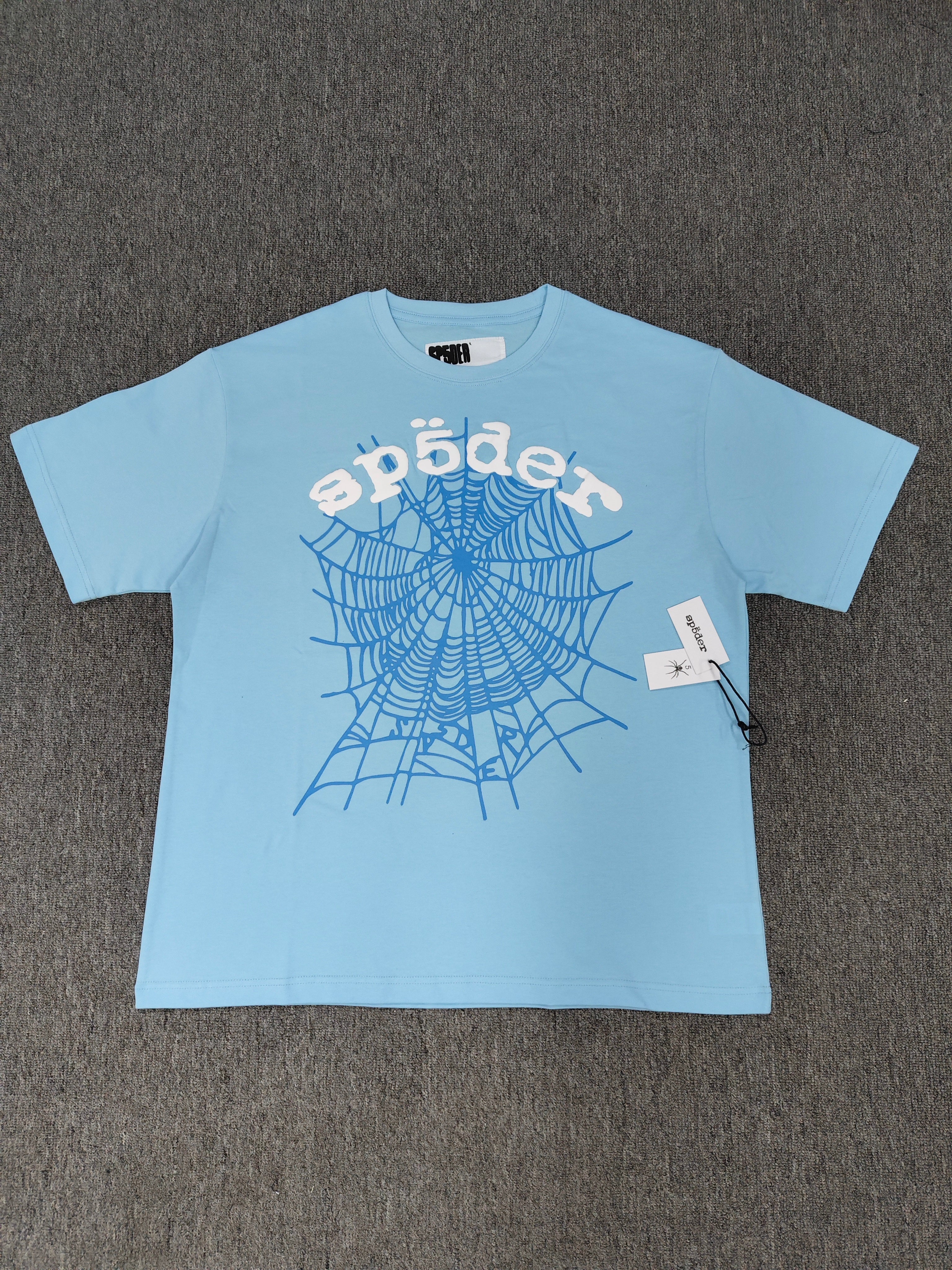 Sp5der shirts are featured in multiple colorways with prominent spiderweb branding