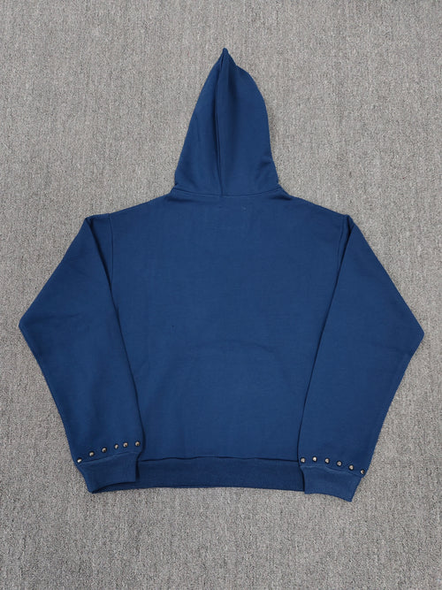 a blue Sp5der Punk V3 Studded Hoodie, featuring rhinestone-accented branding and silver stud details along the hood, logo, and pocket