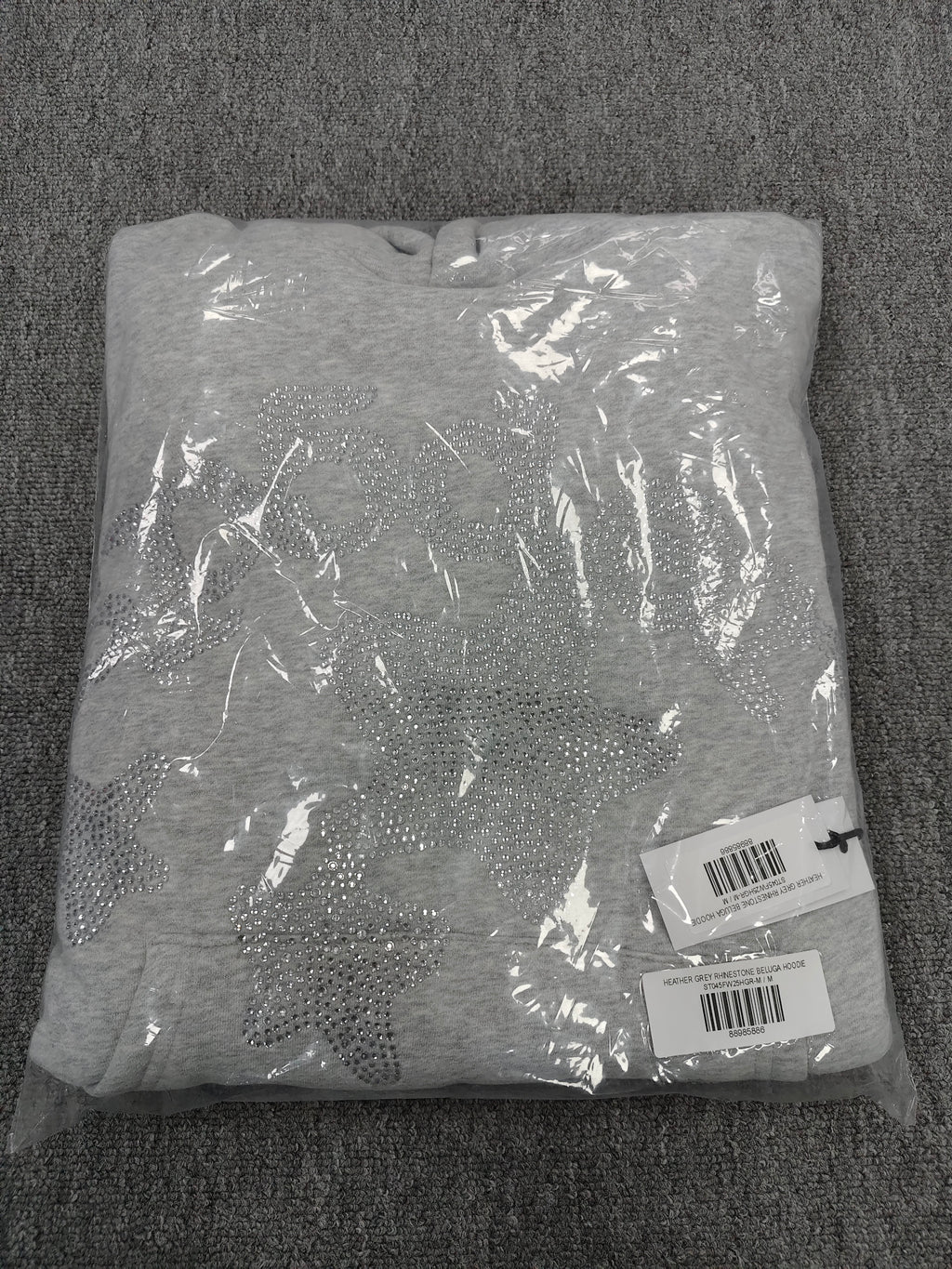 heather grey Sp5der Rhinestone Beluga hoodie features prominent crystal-embellished star designs on the front and sleeves