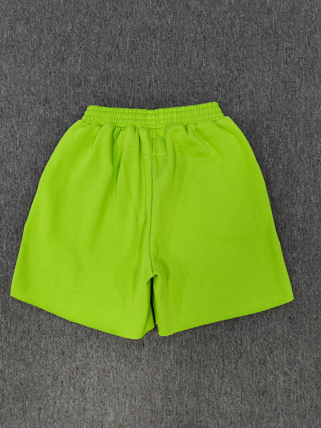 neon green Sp5der OG Web V2 sweatshorts feature a white logo print across the front