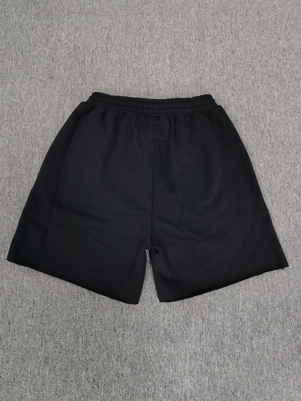 Sp5der Beluga Outline Sweatshorts in black, featuring prominent red-outlined graphic logos and stars