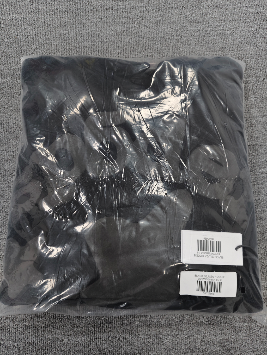 a Sp5der Reflective Beluga Hoodie in Black, featuring large reflective graphics