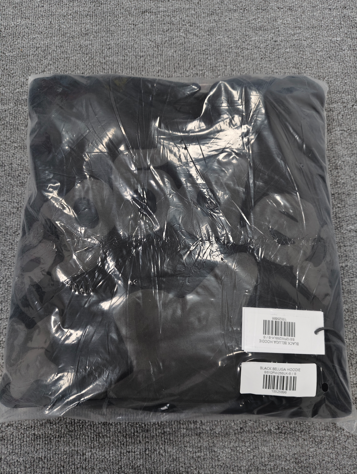 a Sp5der Reflective Beluga Hoodie in Black, featuring large reflective graphics