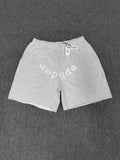 Sp5der VVS sweatshorts in heather grey feature a rhinestone logo and raw edge hemlines
