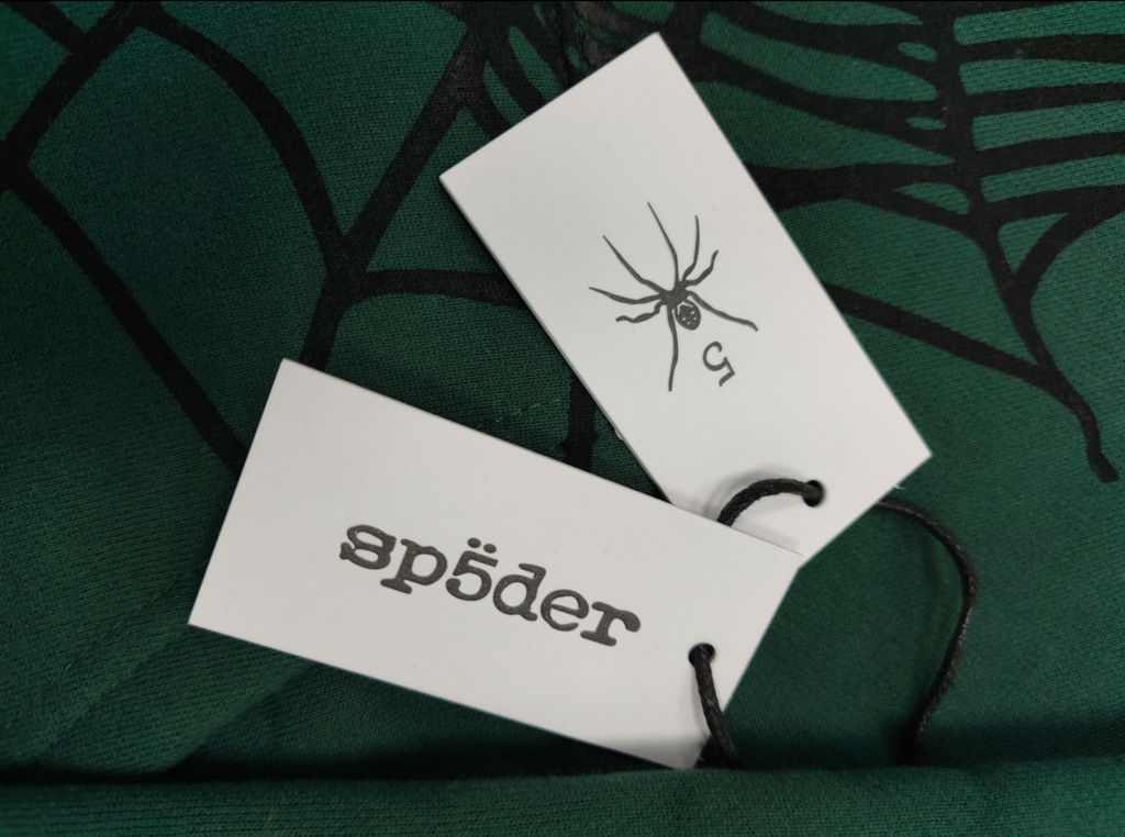 Sp5der OG Web Studded Zip Hoodie in green featuring black graphic detailing