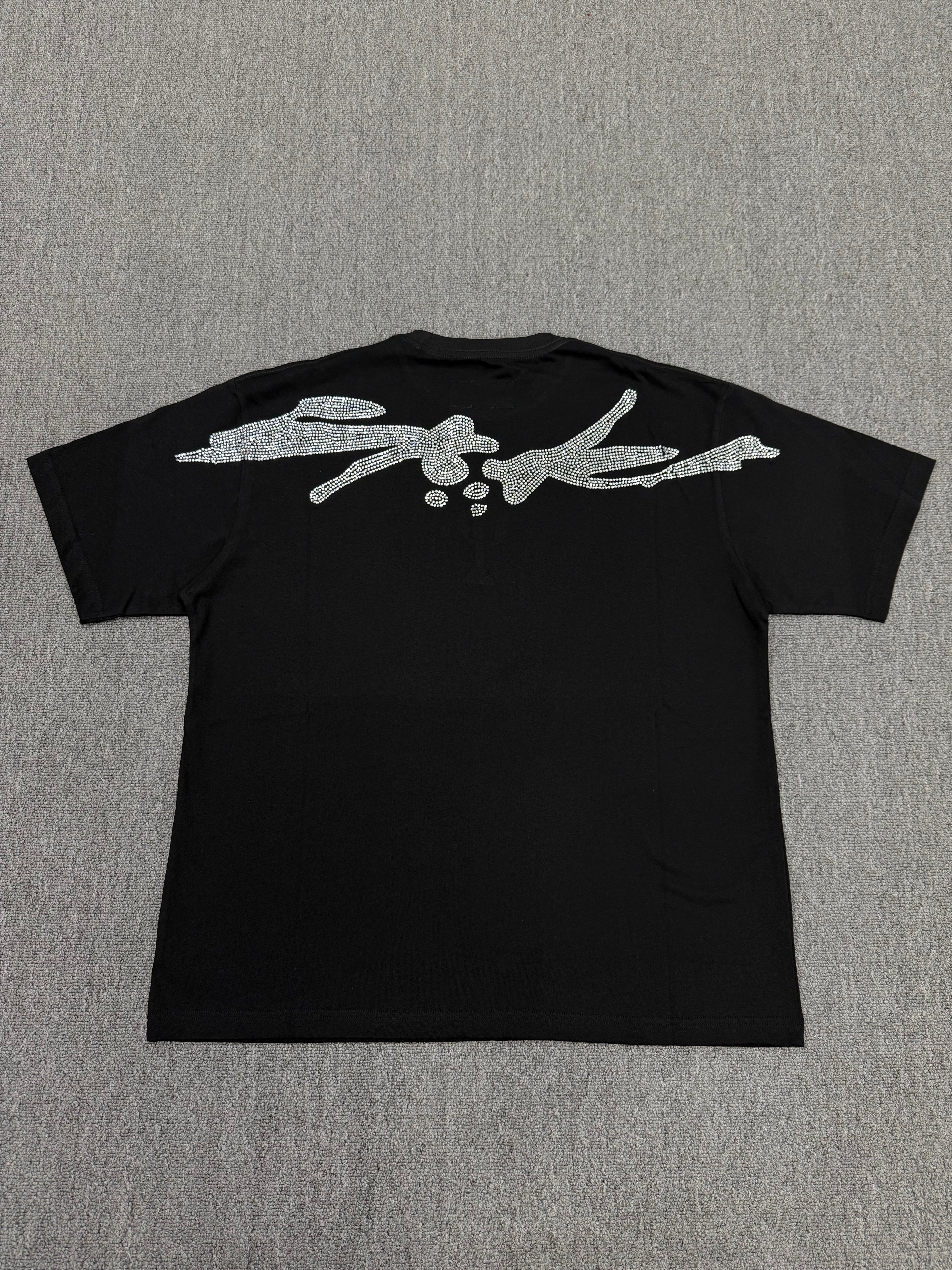 a black Sp5der VAA TM Tee from the Fall/Winter 2025 collection, featuring a rhinestone-embellished cactus graphic