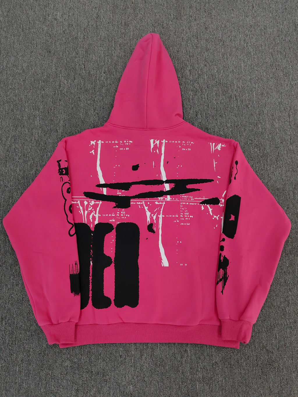 hot pink Sp5der hoodie featuring large, bold black screen-printed graphics on the front and arms.
