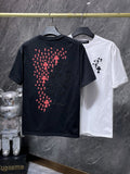 a Chrome Hearts branded short-sleeve t-shirt featuring distinctive embroidered gothic cross and horseshoe graphic details on the back