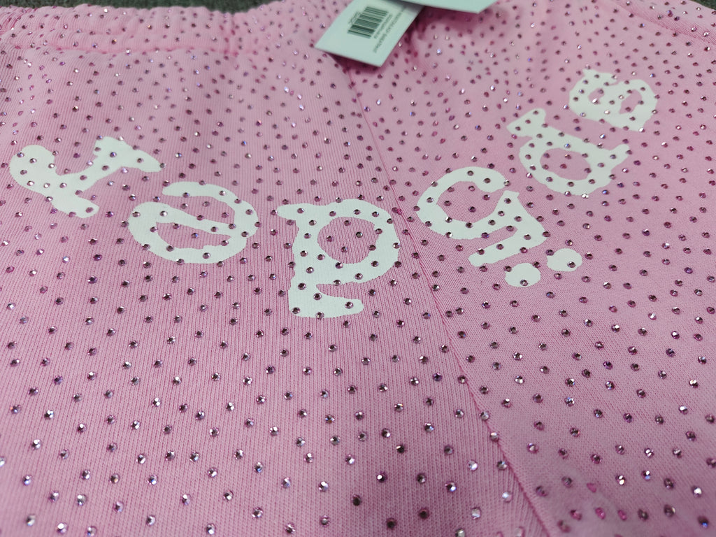 pink Sp5der sweatpants feature an all-over tonal rhinestone application and a SP5DER logo printed across the crotch