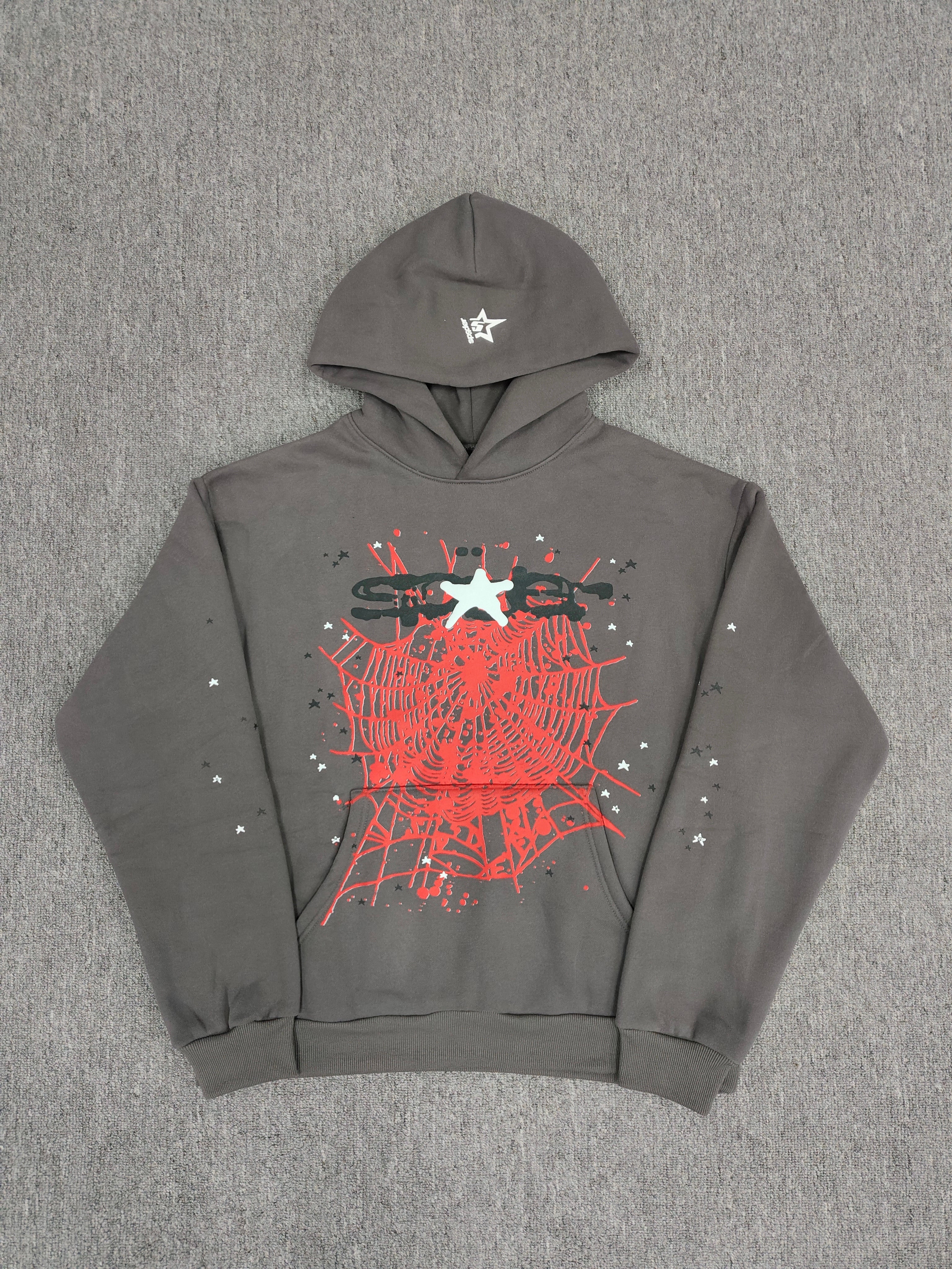 slate grey Sp5der Splat Punk Hoodie features a prominent red spider-web graphic with white star accents