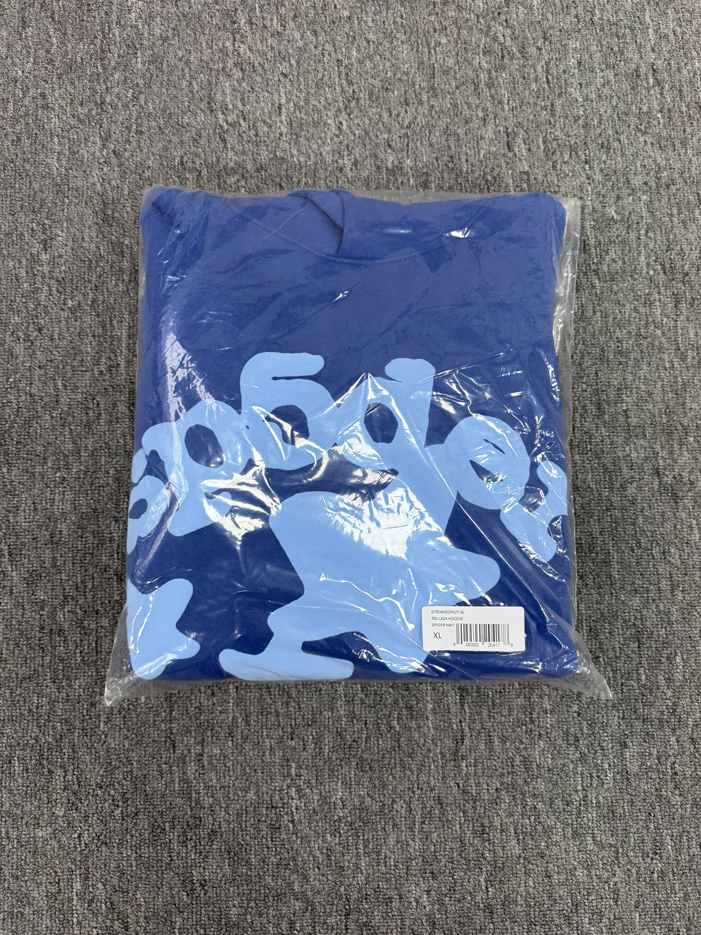 blue Sp5der Beluga hoodie features a distinct light blue graphic print of stars and the brand name on the front and sleeves