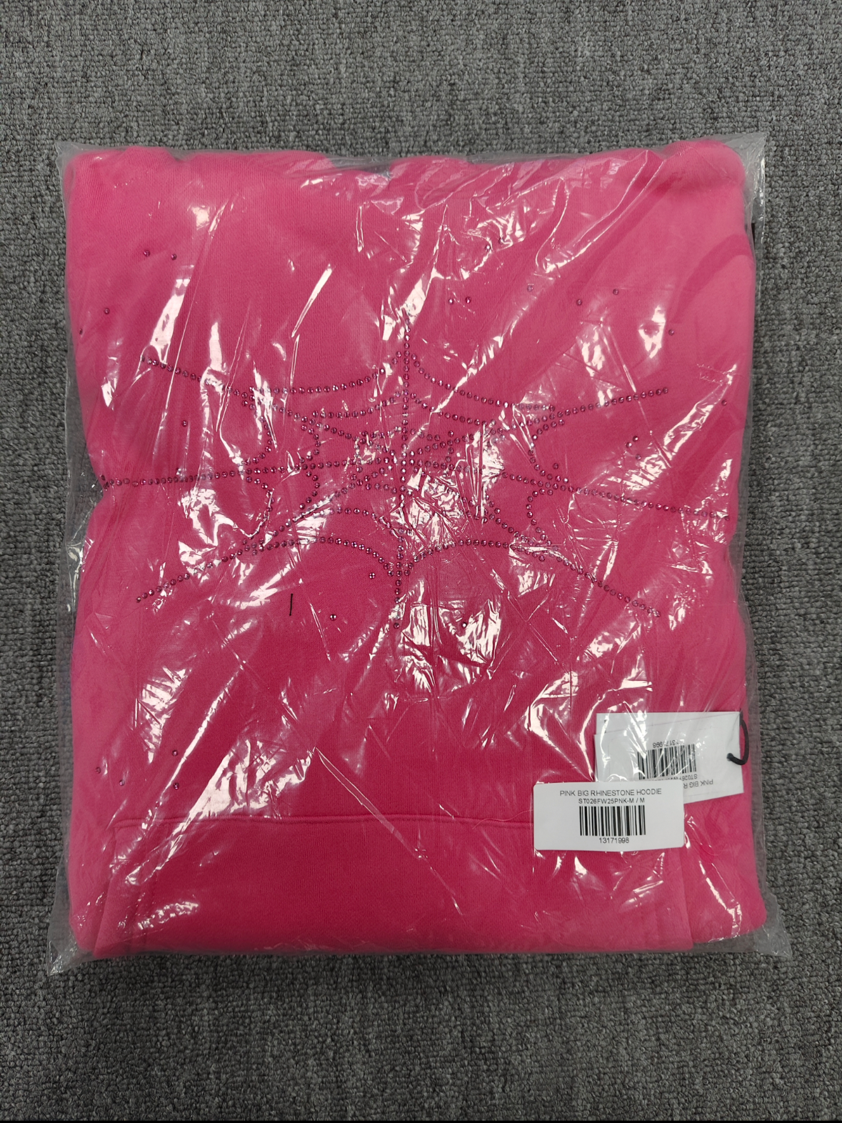 Sp5der Rhinestone Silk Hoodie in pink featuring a prominent rhinestone spiderweb graphic