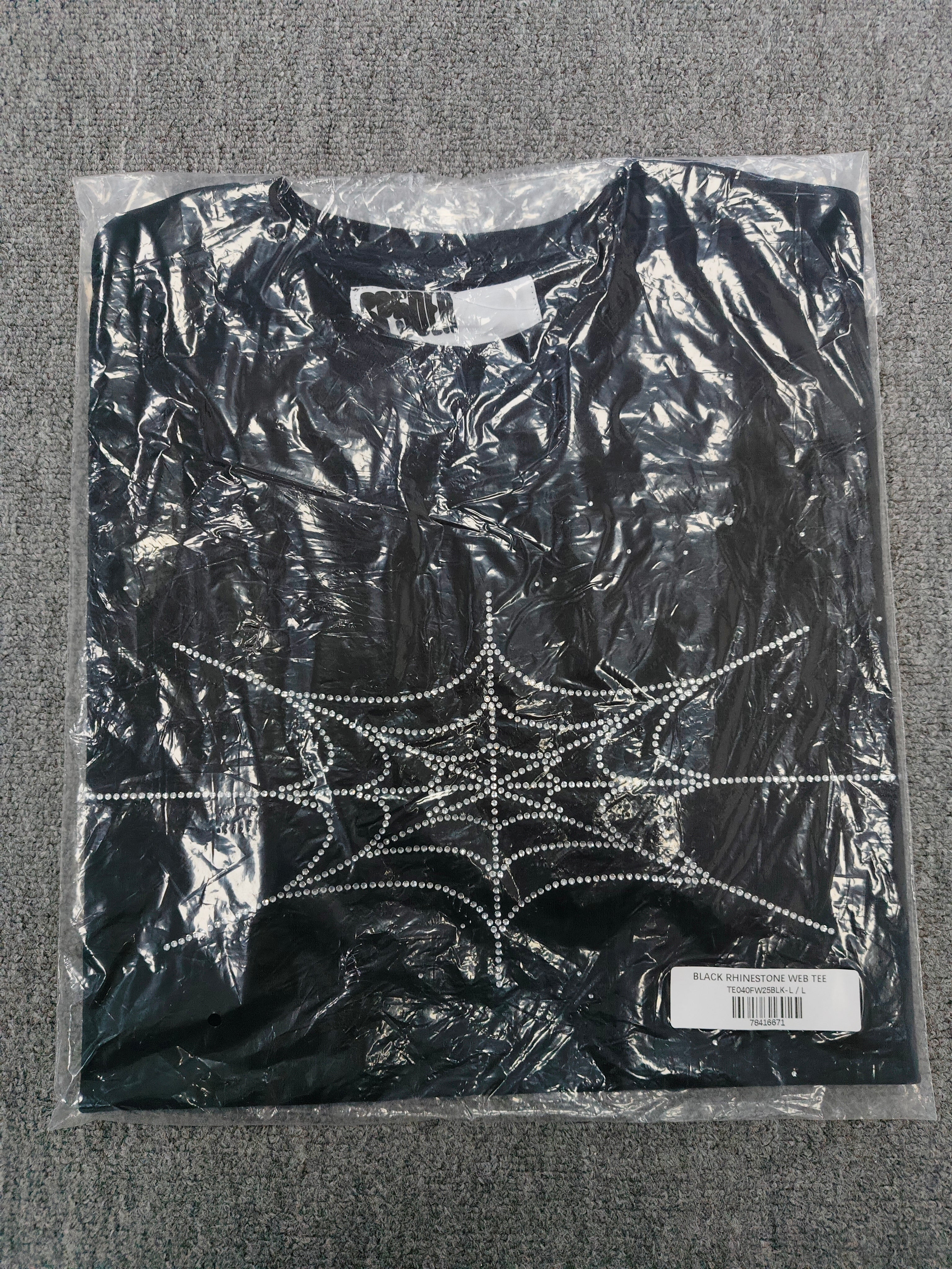 black Sp5der Rhinestone Silk Tee features a prominent crystal-embellished spider web graphic on the chest