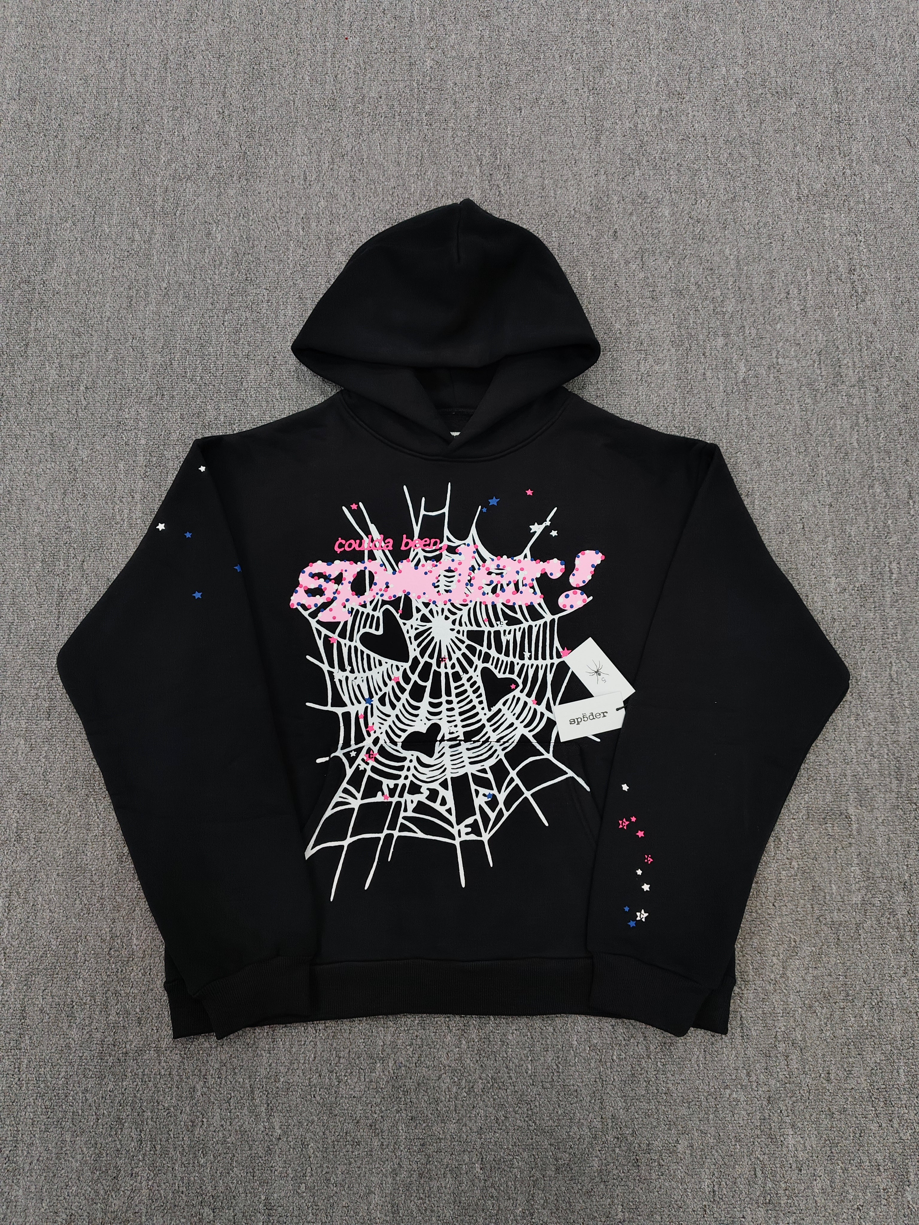 SP5DER CB Punk V2 Hoodie features a bold pink and white cobweb graphic on the chest
