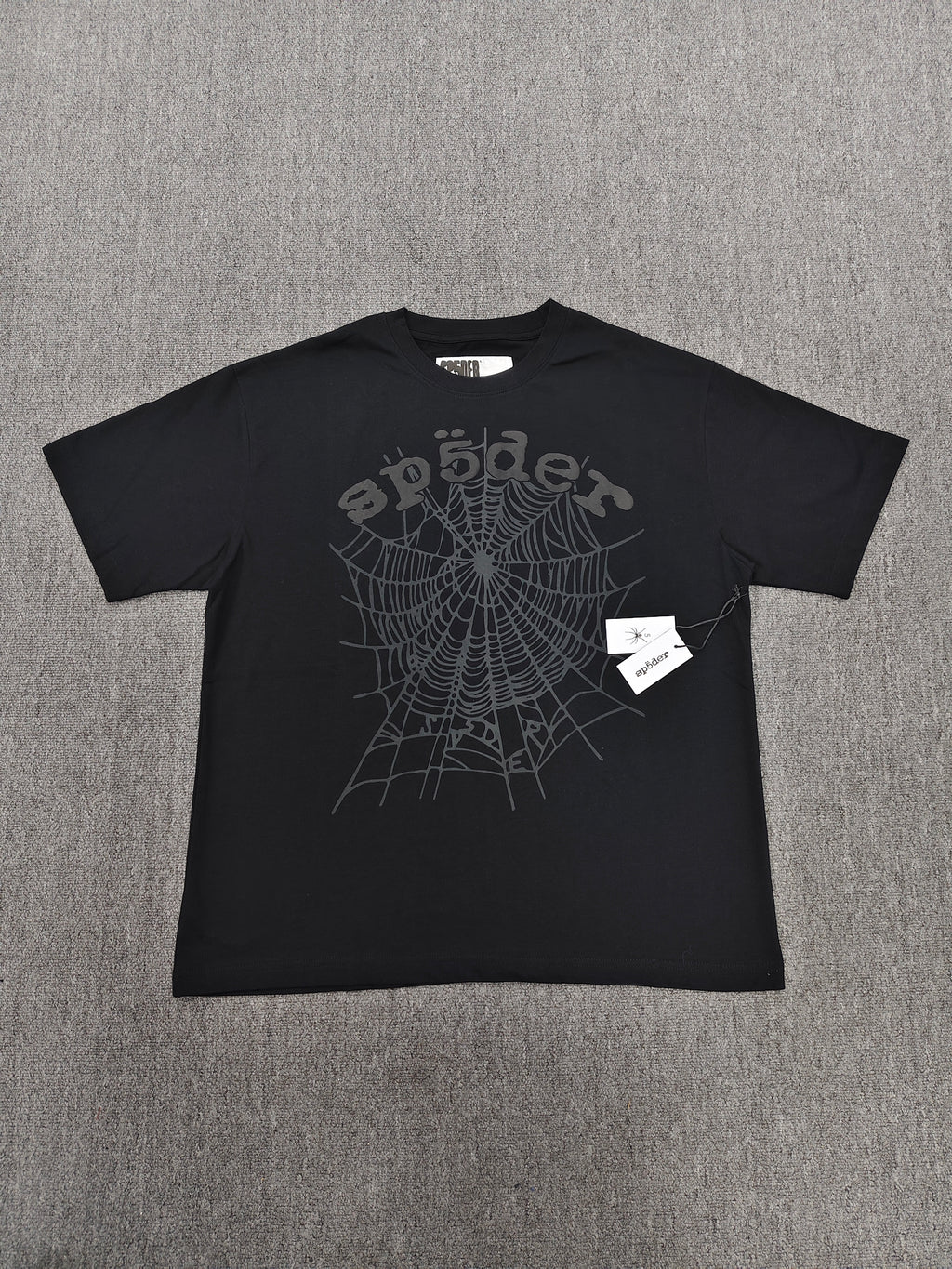 Sp5der Phantom OG Web Tee in black features a large gray spiderweb graphic on the chest