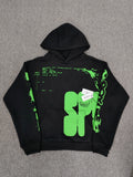 Sp5der Black Neon Green Skull Graphic Hoodie, featuring bold neon green graphics on a black base