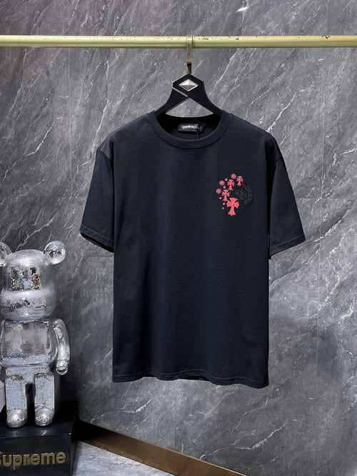 a Chrome Hearts branded short-sleeve t-shirt featuring distinctive embroidered gothic cross and horseshoe graphic details on the back