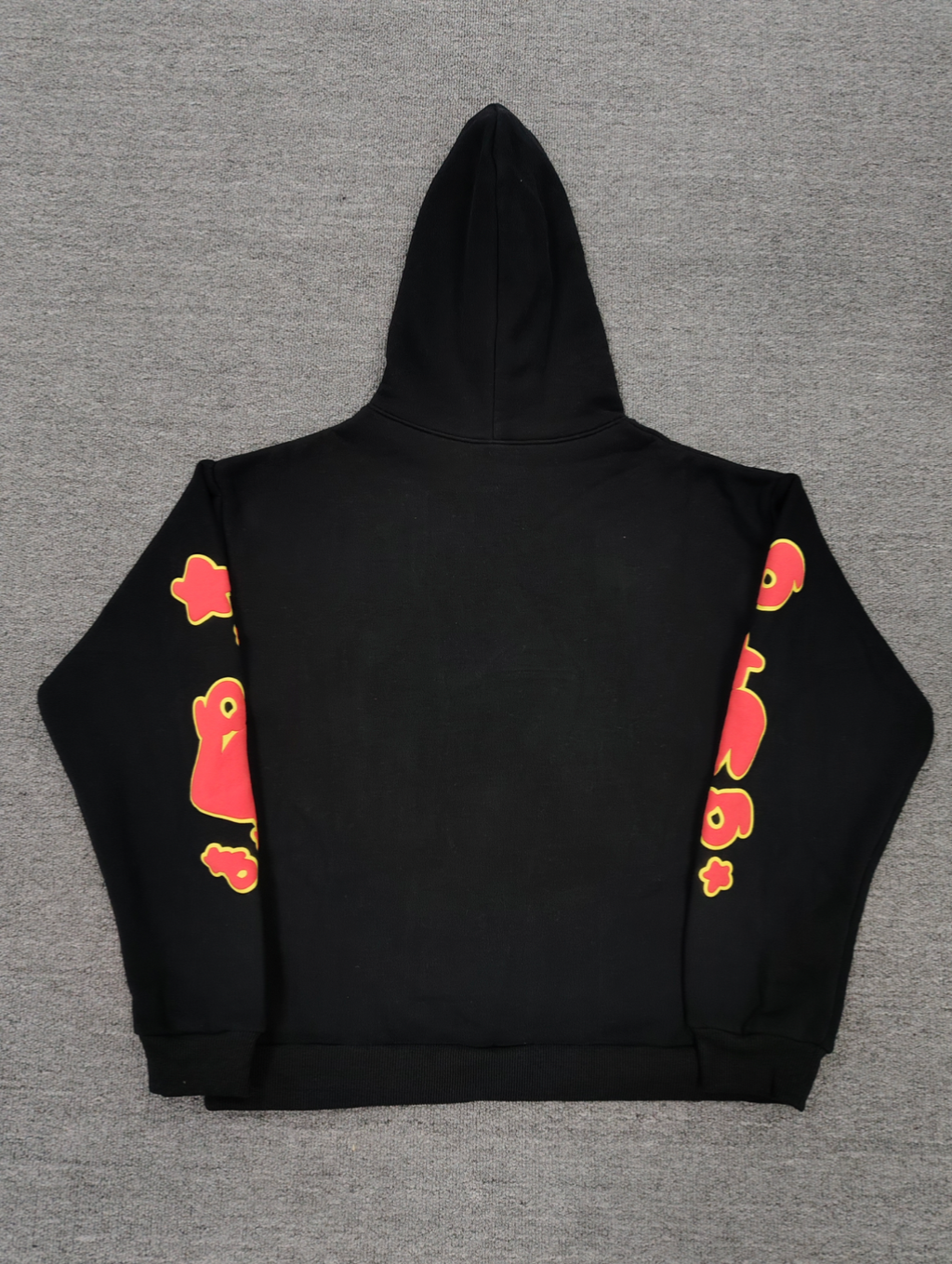 a Sp5der OG Web V2 Hoodie in a fire-like orange contrast on a black base.