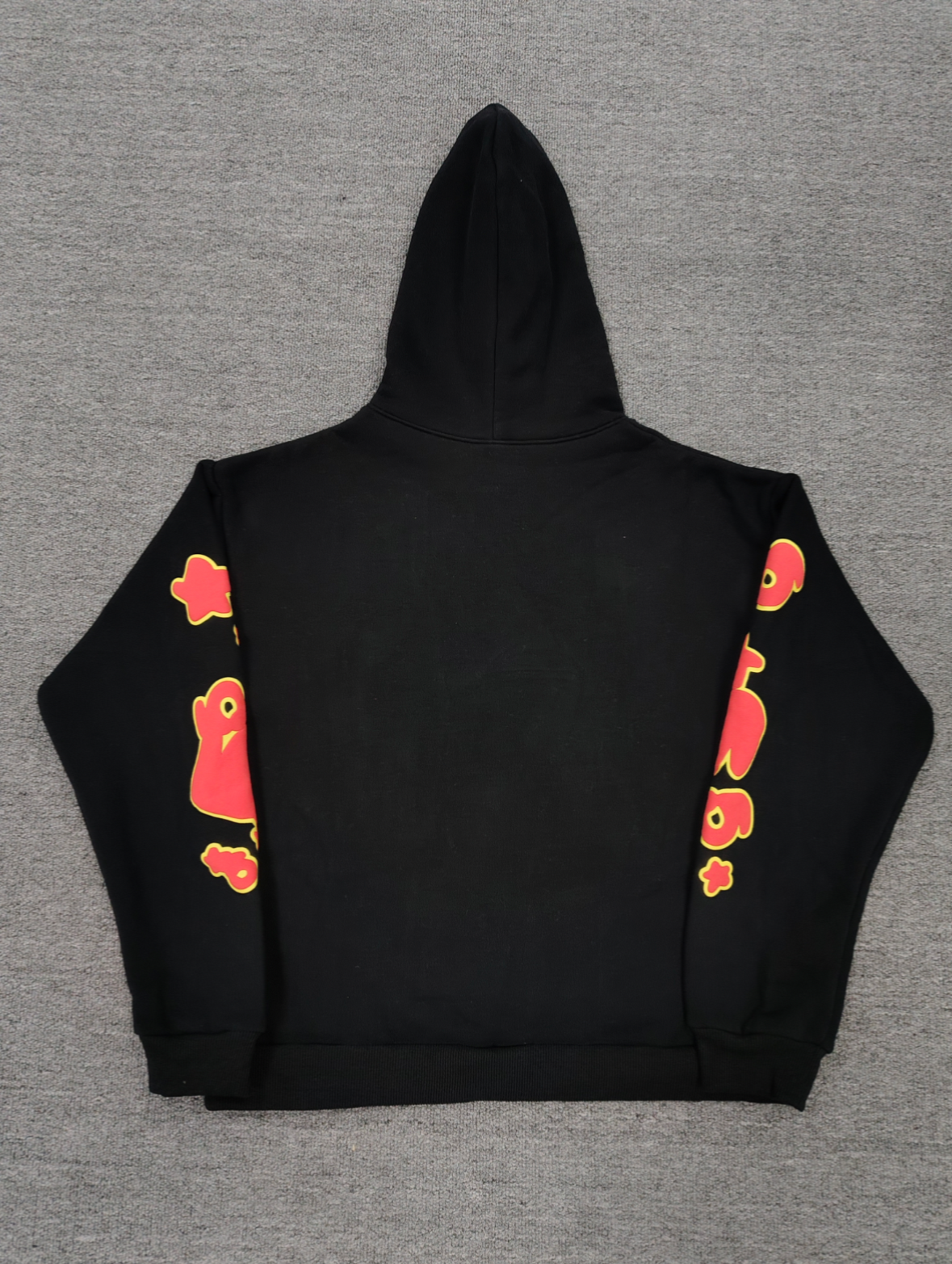 a Sp5der OG Web V2 Hoodie in a fire-like orange contrast on a black base.