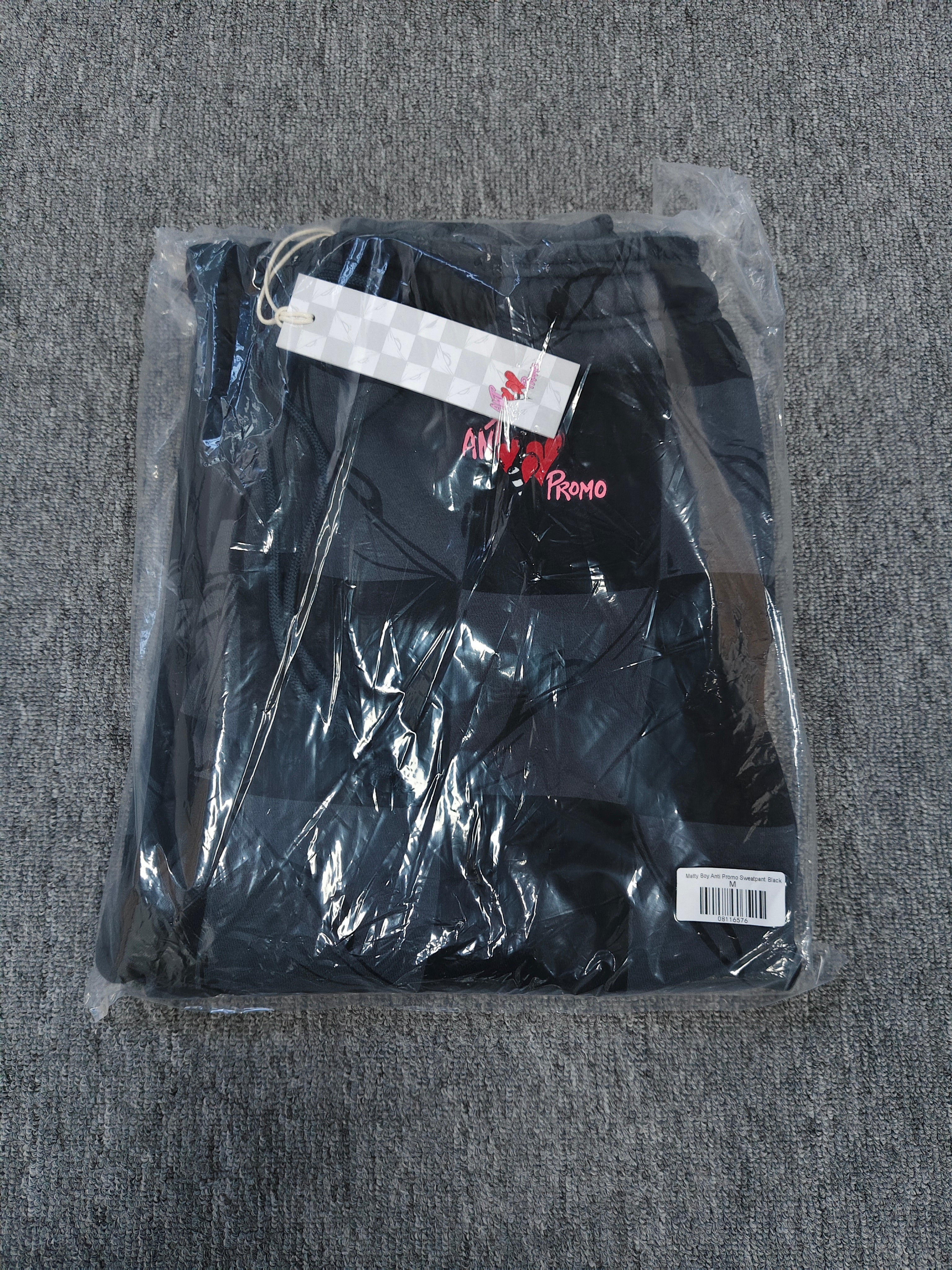 Chrome hearts Matty Boy Anti Promo 99 Eyes sweatpants in a black and grey checkerboard pattern.