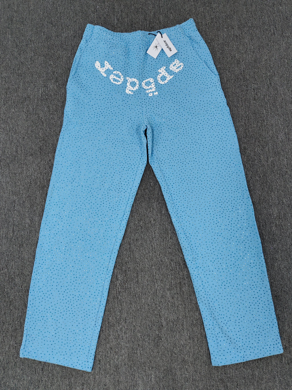 sky blue Sp5der Classic Sweatpants feature an all-over rhinestone design and the brand's logo in a sparkling applique