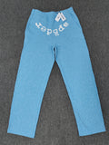 sky blue Sp5der Classic Sweatpants feature an all-over rhinestone design and the brand's logo in a sparkling applique