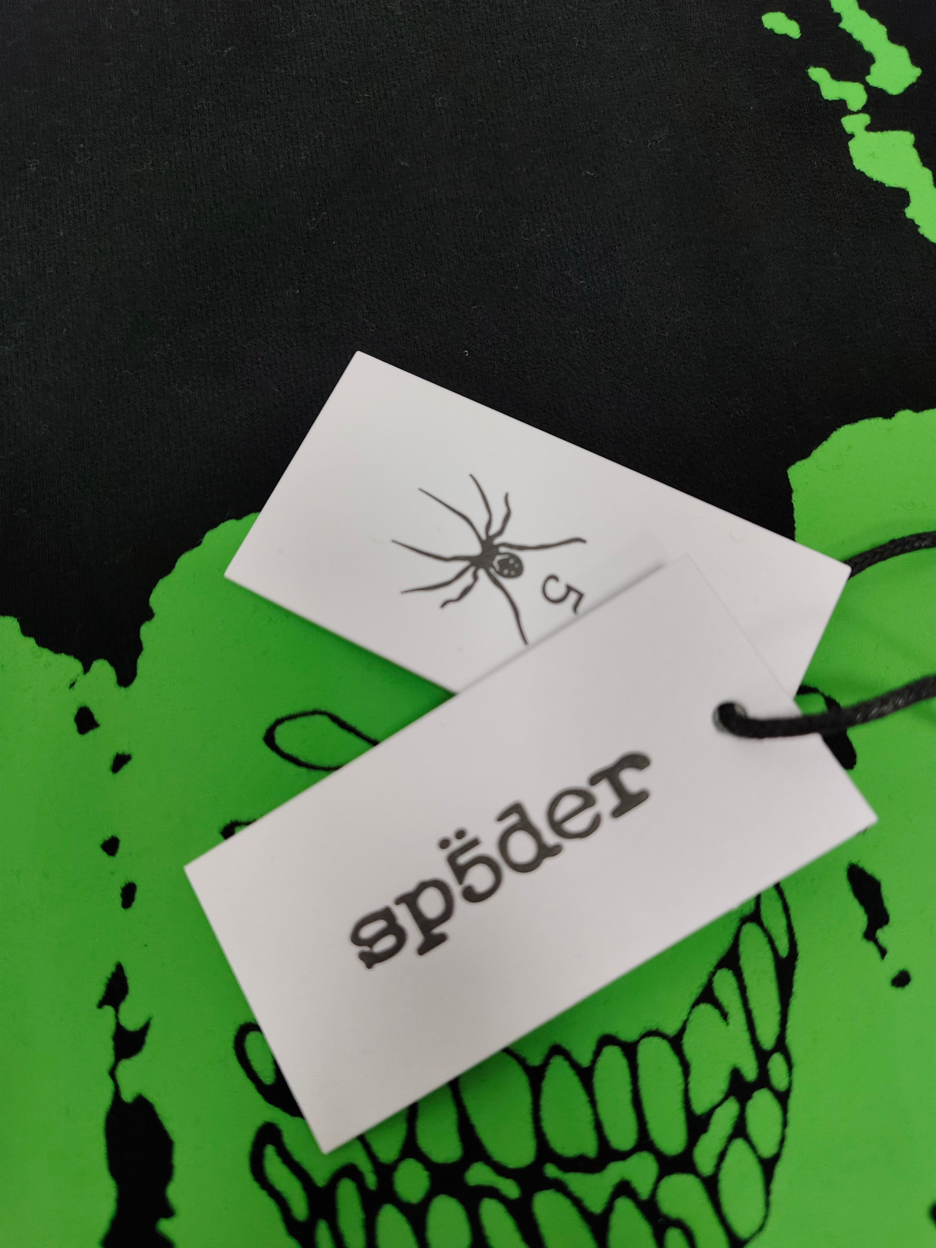 Sp5der Black Neon Green Skull Graphic Hoodie, featuring bold neon green graphics on a black base