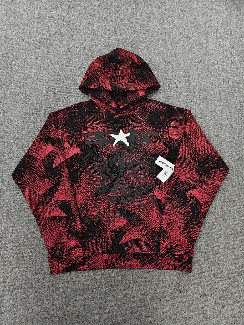 a Sp5der Plaid Splatt Hoodie in red, featuring a prominent white star graphic
