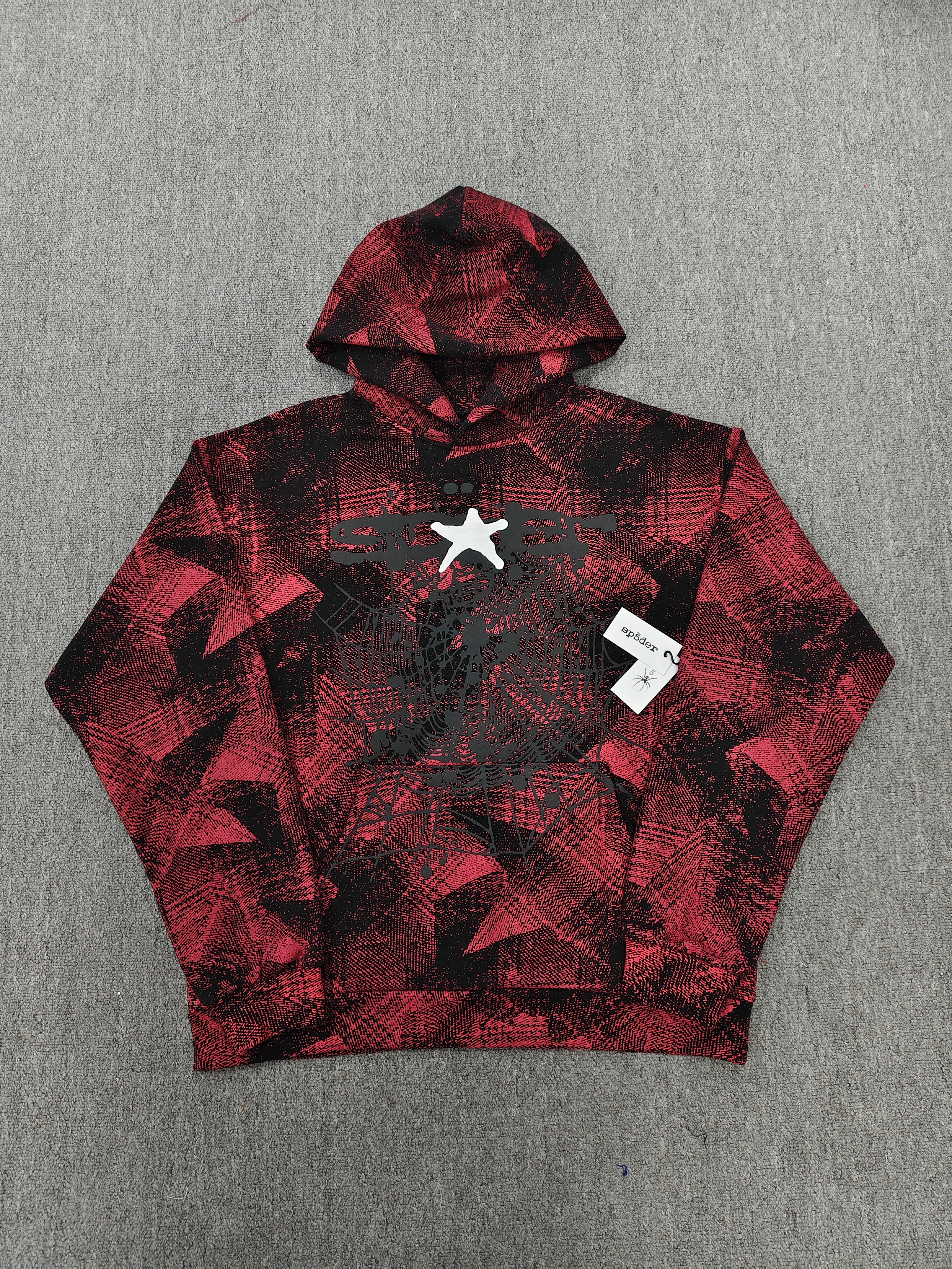 a Sp5der Plaid Splatt Hoodie in red, featuring a prominent white star graphic