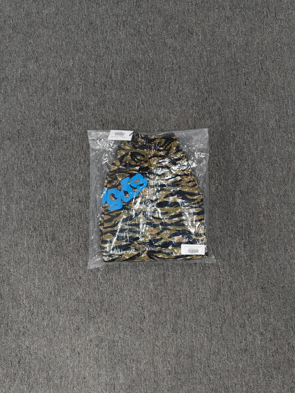 Sp5der OG Web V2 Tiger Camo Sweatshorts featuring a prominent tiger stripe pattern and an elasticated waistband