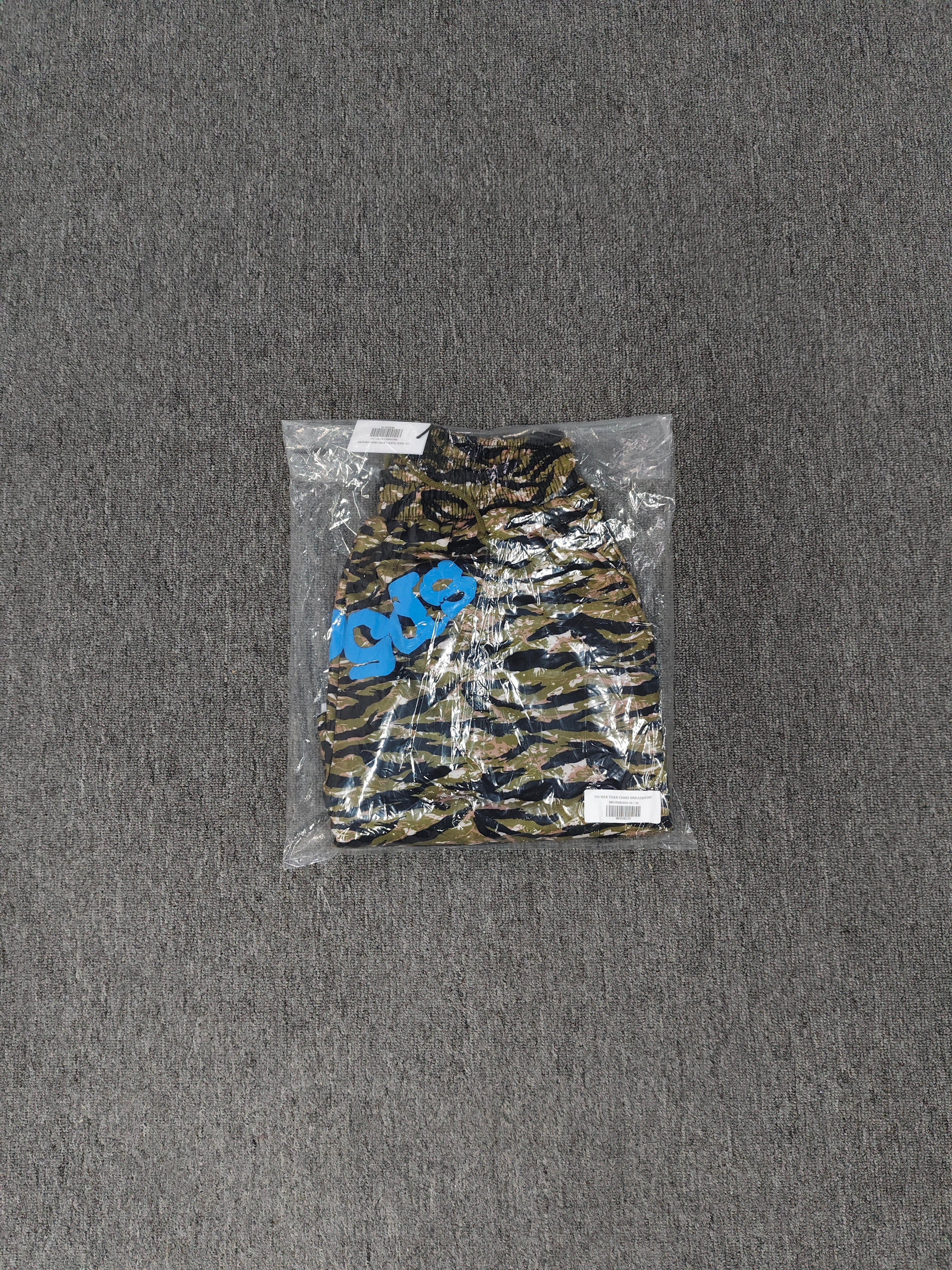 Sp5der OG Web V2 Tiger Camo Sweatshorts featuring a prominent tiger stripe pattern and an elasticated waistband