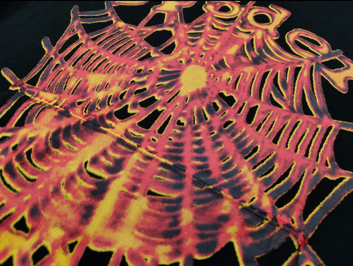 a Sp5der OG Web V2 Hoodie in a fire-like orange contrast on a black base.
