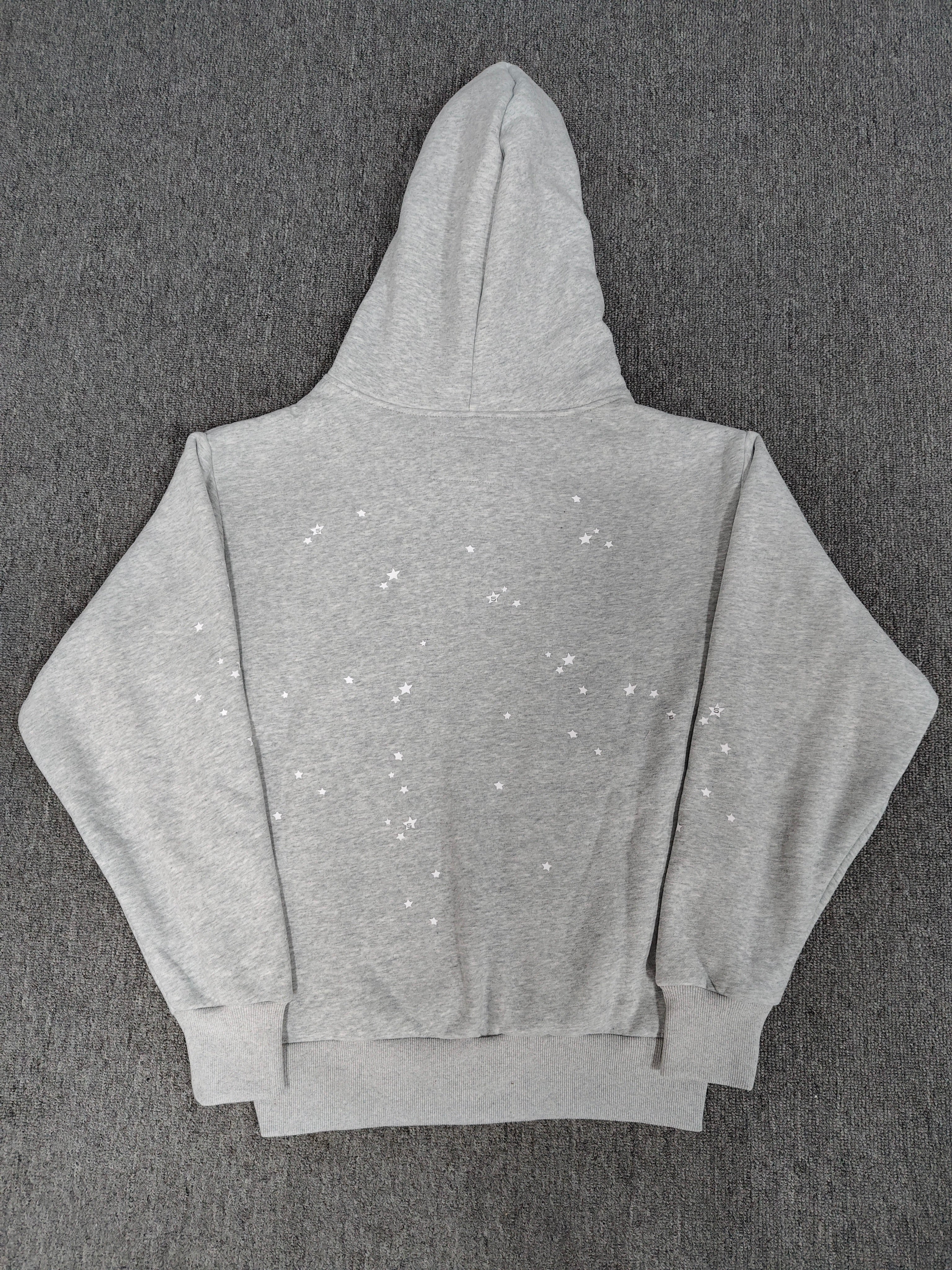 Sp5der Atlanta Full Zip Hoodie in Heather Grey, featuring a red "Atlanta" logo graphic with navy blue star accents