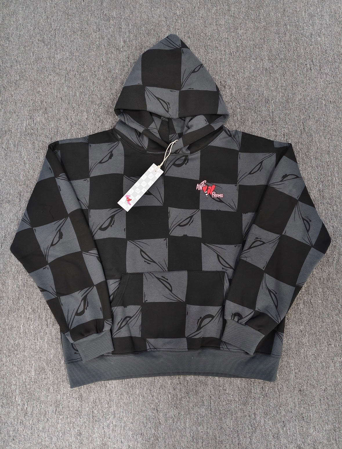 a Chrome Hearts Matty Boy "Anti Promo" 99 Eyes Hoodie featuring a checkered pattern.