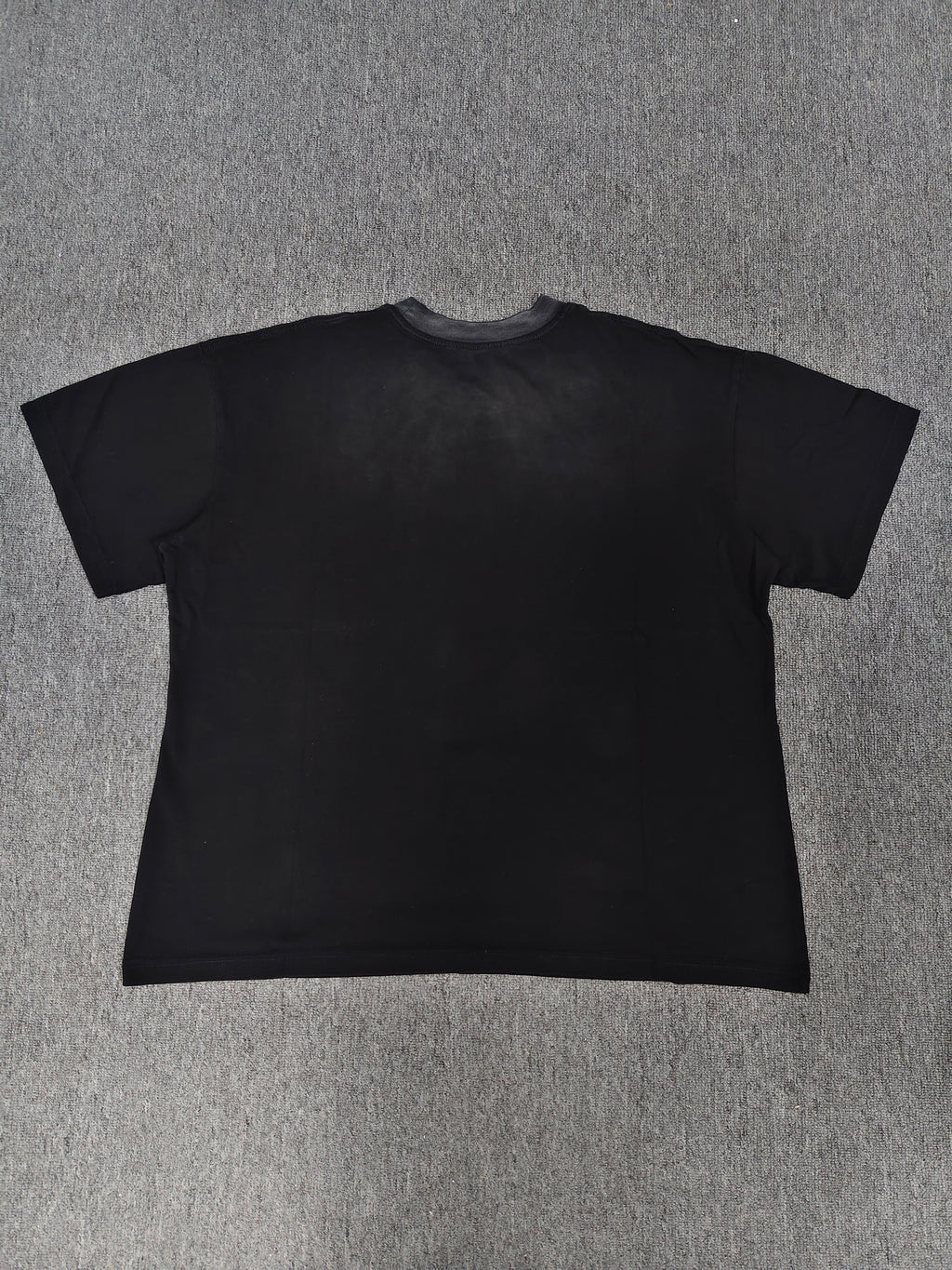 a black Travis Scott x Sp5der "Days Before Rodeo" collaboration t-shirt featuring a distinctive red "Rodeo" graphic and faded branding