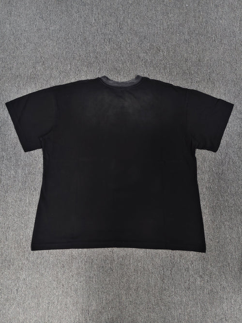 a black Travis Scott x Sp5der "Days Before Rodeo" collaboration t-shirt featuring a distinctive red "Rodeo" graphic and faded branding