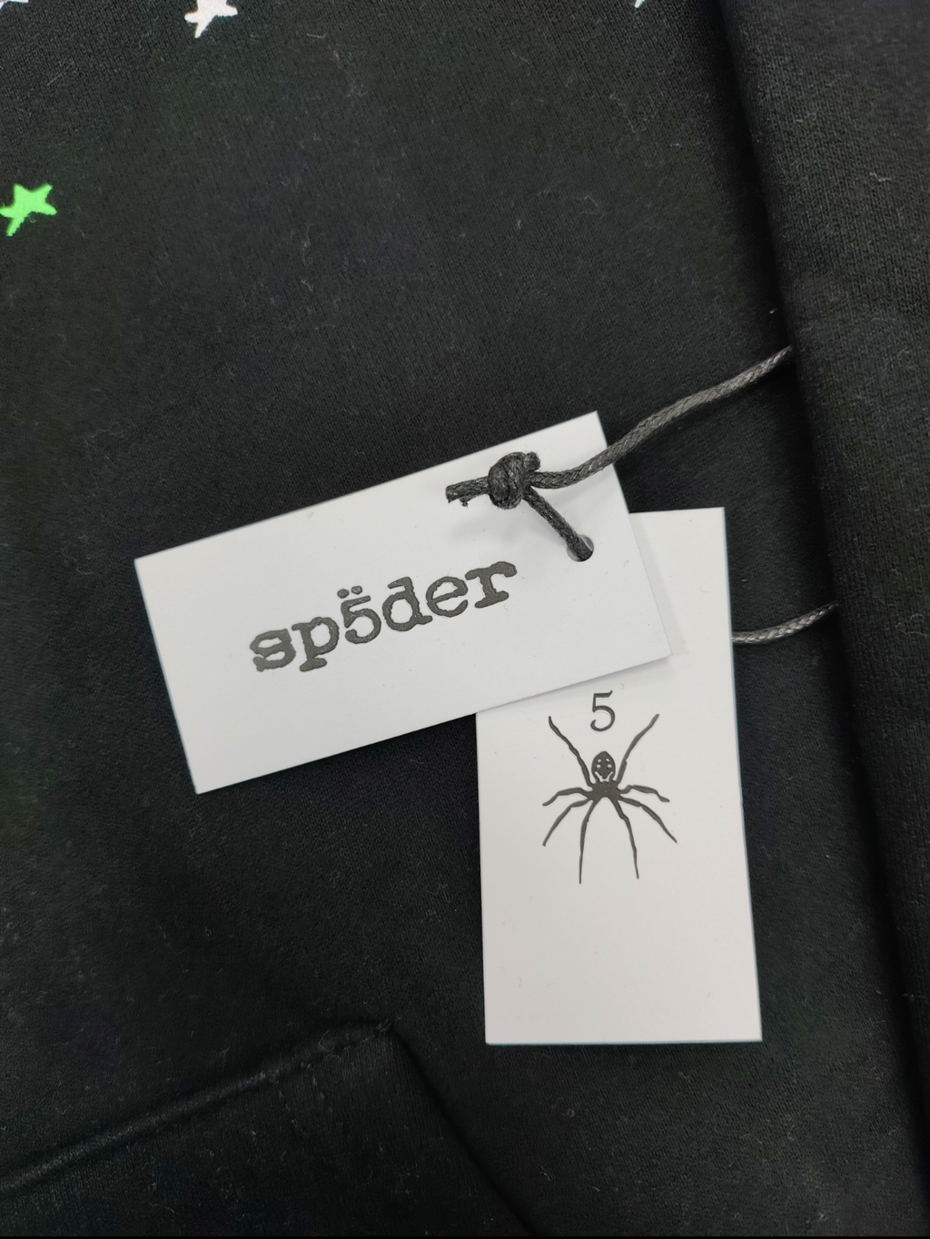 Sp5der Heavy Web Hoodie in black features a striking green and white star graphic print